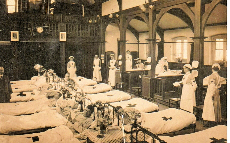 59, Christ Church Halls as a Red Cross hospital during World War 1. The man on the left is Leon Degroote, a recovering Belgian soldier working as an orderly.jpg